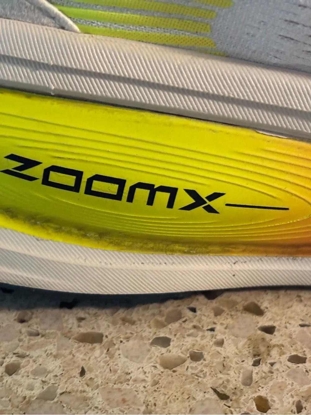 Nike White Volmero 18 Running Shoes with Neon Yellow-Orange Accent